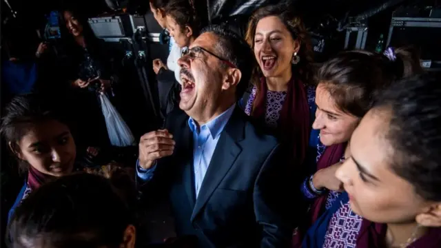 Dr Ahmad Sarmast surrounded by the members of his orchestra after a performance in Slovakia