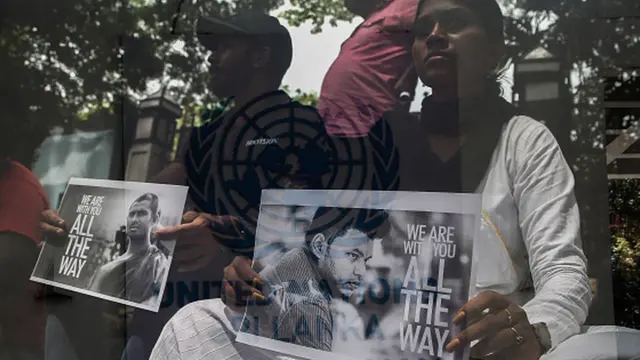 Anti-government demonstrators stage a Satyagraha protest against the government in front of the United Nations office, asking the United Nations to force the government to release the leader of the Inter-University Students' Union Wasantha Mudalige and Reverend Galvewa Siridhamma Thero, in Colombo on November 11, 2022.