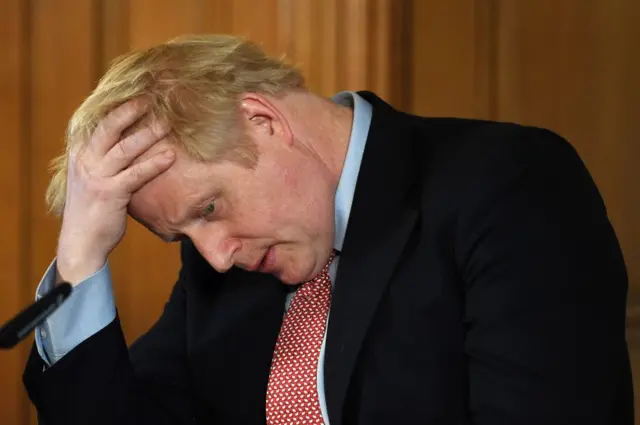 British Prime Minister Boris Johnson speaks during a news conference inside 10 Downing Street