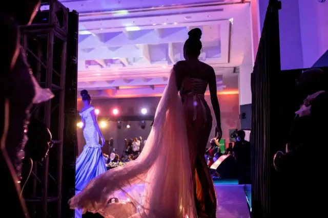 A contestant gets ready backstage during the Miss Kenya beauty pageant in Nairobi, on August 28, 2021.