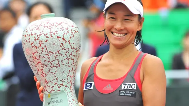 Kimiko Date holds the winner's trophy at the Korea Open Tennis championship in Seoul on September 27, 2009.