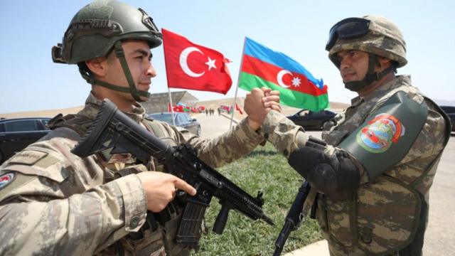 Troops from Azerbaijan and Turkey shaking hands, Aug 2020