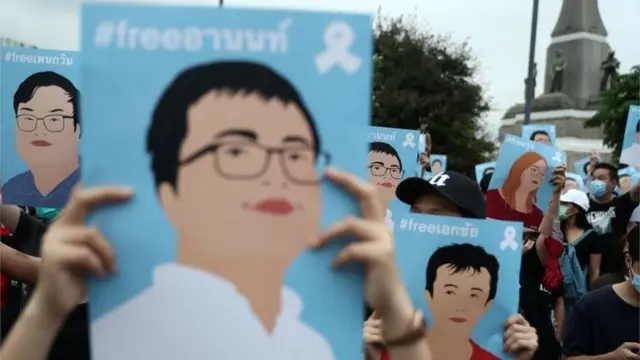 Pro-democracy demonstrators hold posters of protest leaders who have been arrested during an anti-government protest, in Bangkok, Thailand October 18, 2020