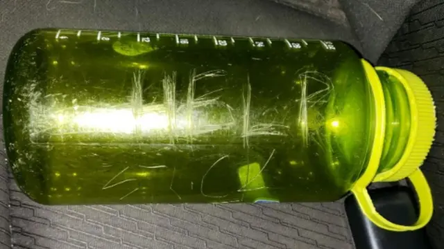 Curtis Whitson placed the SOS note in a green drinking bottle, pictured here