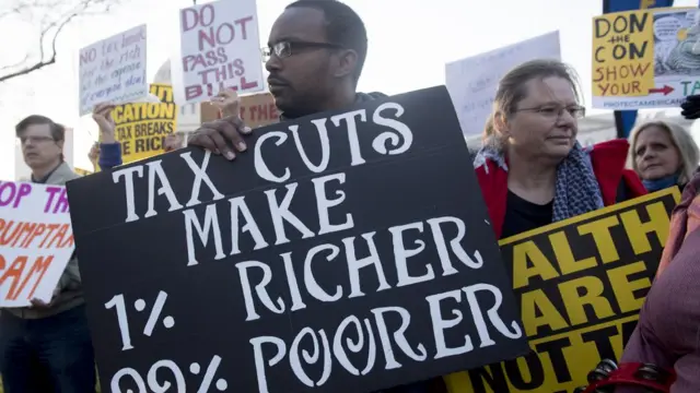 Demonstrators against the Republican tax reform bill hold a 'Peoples Filibuster to Stop Tax Cuts for Billionaires,' protest rally outside the US Capitol on Capitol Hill in Washington, DC, November 30, 2017.