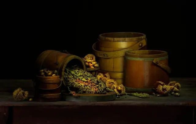 A still life of barrels and vegetables