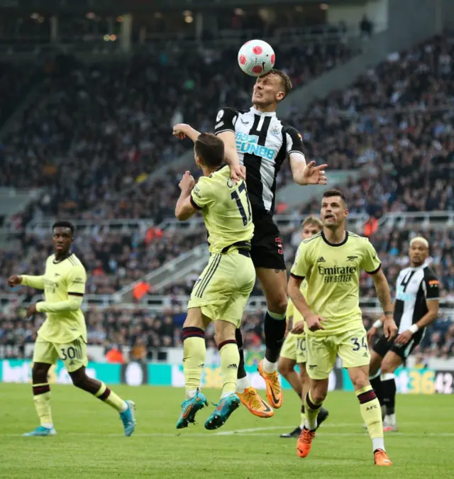 Newcastle United Dan Burn battle wit Arsenal Cedric Soares