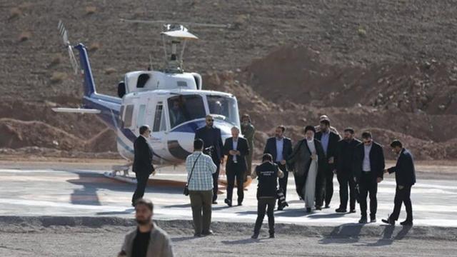 An image of Iran's President Ebrahim Raisi near a helicopter prior to crash reports 