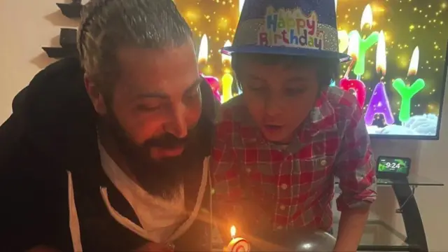 Oday al-Fayoume and his son Wadea on his birthday