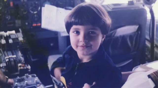 A picture of Nour aged 4 in the cockpit of a 727 jet