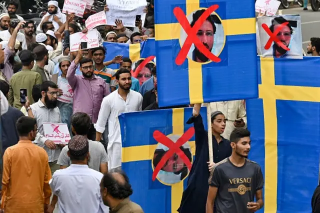 People take part in an anti-Sweden demonstration in Lahore on July 9, 2023, as they protest against the burning of the Koran outside a Stockholm mosque that outraged Muslims around the world.