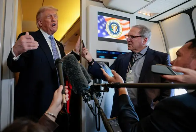 Donald Trump speaks to the press aboard Air Force One en route to the U.S. following his official visit with President Xi Jinping in China, May 15, 2026.