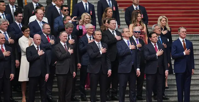 Members of the U.S. delegation and CEOs from various industries stand prior to a welcome ceremony for U.S. President Donald Trump outside the Great Hall of the People on May 14, 2026 in Beijing, China.