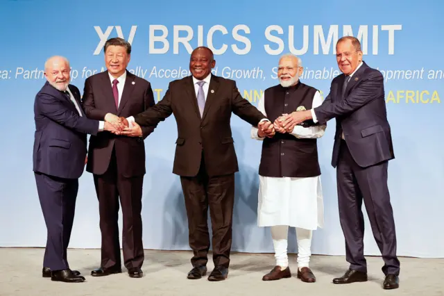 (From L to R) President of Brazil Luiz Inacio Lula da Silva, President of China Xi Jinping, South African President Cyril Ramaphosa, Prime Minister of India Narendra Modi and Russia's Foreign Minister Sergei Lavrov pose for a Brics family photo during the 2023 Brics summit at the Sandton Convention Centre in Johannesburg on 23 August 23 2023. 