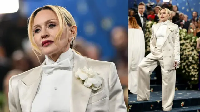 Icyamamare Madonna yaserutse yambaye tuxedo y'ibara rya cream afite n'itabi rya cigar