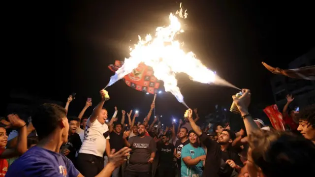 Al Ahly fans celebrate with fire flames in Cairo's Mokattam district, Egypt - Sunday 11 June 2023