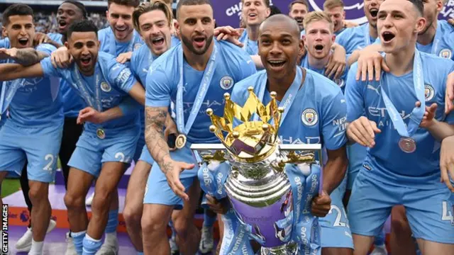 Fernandinho (with the trophy)