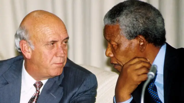 Nelson Mandela talking to FW de Klerk in 2010