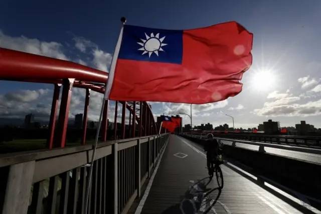 People drive past Taiwan flags installation ahead of National Day celebrations in Taipei, Taiwan, 06 October 2021. On 05 October,