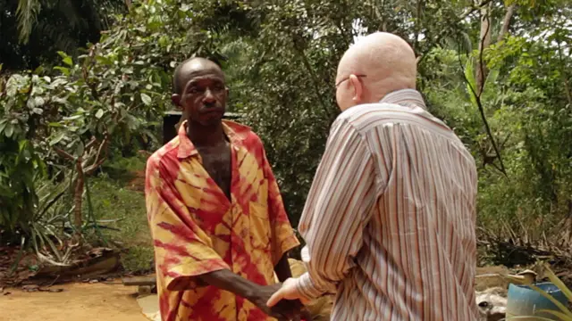 the witch doctor and Stephane shake hands