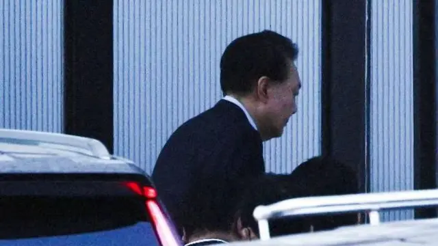 South Korea president being escorted