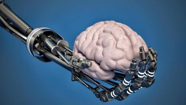 Robot hand holding brain
