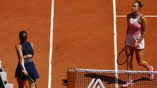 Marta Kostyuk walks to her chair without shaking Aryna Sabalenka's hand