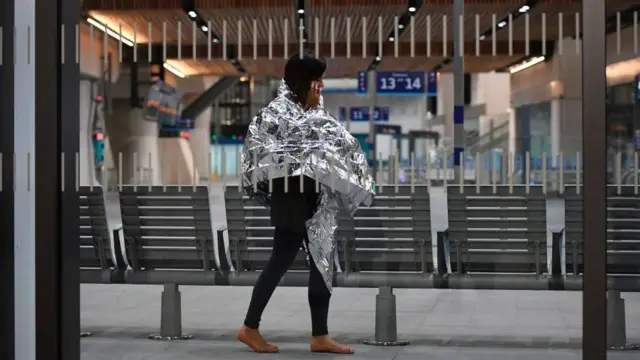 A woman walks through London Bridge after the attack