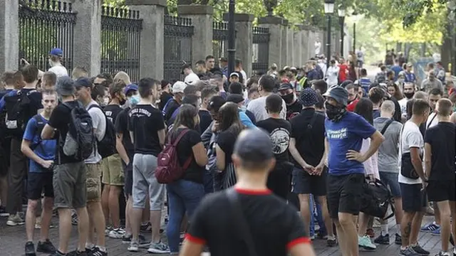 Dynamo Kyiv fans gather outside the club's stadium to state their opposition to Lucescu's appointment