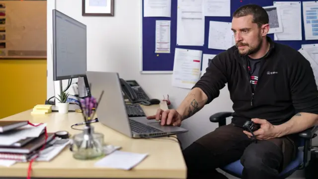 Dan McKenzie sat at his desk at the Halley VI Research Station