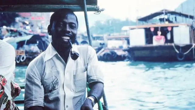 Ken Saro-Wiwa sitting at the waterfront