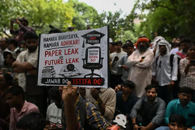 supporter of CJP holds a placard demanding accountability over alleged examination paper leaks during a protest on June 06, 2026 in New Delhi, India. The Cockroach Janta Party (CJP) is a viral, Gen Z-led parody movement founded by political communications strategist Abhijeet Dipke, which uses a cockroach as its mascot to mock political dysfunction. (Photo by Ritesh Shukla/Getty Images)