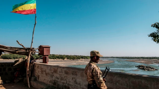 A member of the Amhara Special Forces in Humera watches on at the border crossing with Eritrea - 22 November 2020