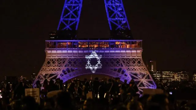 The Eiffel Tower lit up in the colours of the Israeli flag after a Hamas attack killed over 1,300 on 7 October