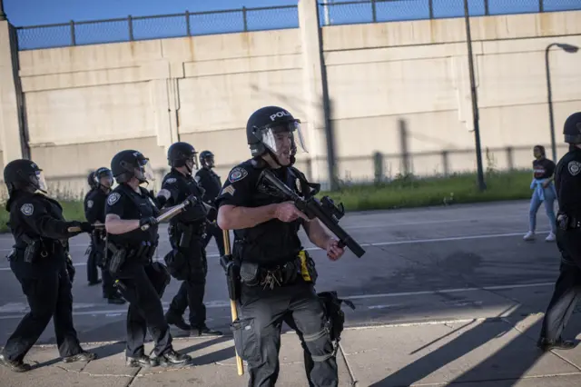 6. Police prepare to disperse demonstrators during protests resulting from the killing of an unarmed black man, George Floyd, by police.