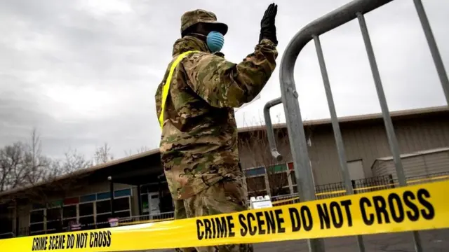 A US National Guard soldier directs patients at a coronavirus testing centre in the Bronx, New York City, 28 March 2020