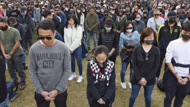 Black-clad protesters gather in Hong Kong