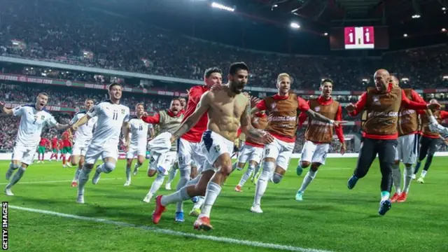 Aleksandar Mitrovic celebrates scoring against Portugal in World Cup qualifying