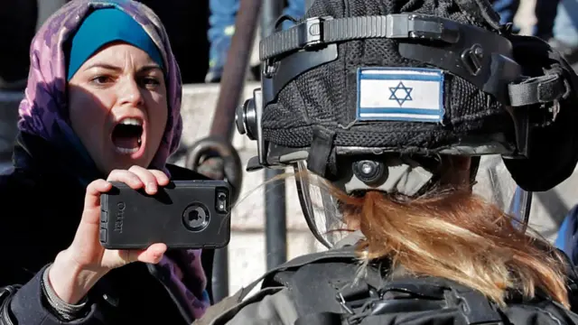 Palestinians scuffle with Israeli forces at Damascus Gate in Jerusalem's Old City on December 8, 2017.