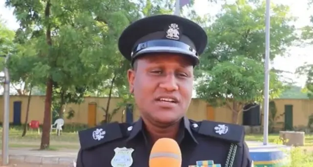 Di officer say gun charm no dey exist for di world