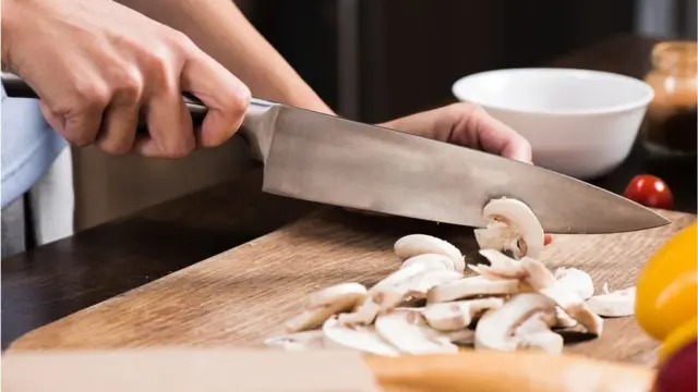 Woman chopping mushrooms