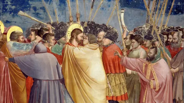 O beijo de Judas, momento em que ele teria traído Jesus, em pintura de Giotto, do início do século 14