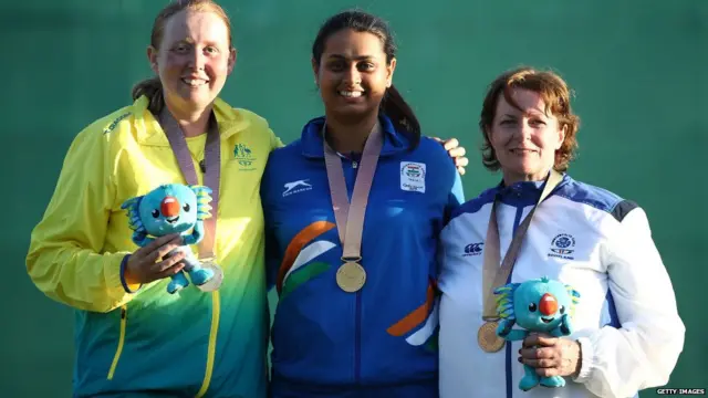Silver medalist Emma Cox of Australia, gold medalist Shreyasi Singh of India and bronze medalist Linda Pearson of Scotland pose during the medal ceremony for the Women's Double Trap Finals on day seven of the Gold Coast 2018 Commonwealth Games