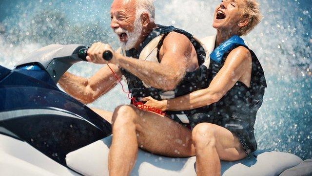 Older man with slightly younger woman on a jet ski