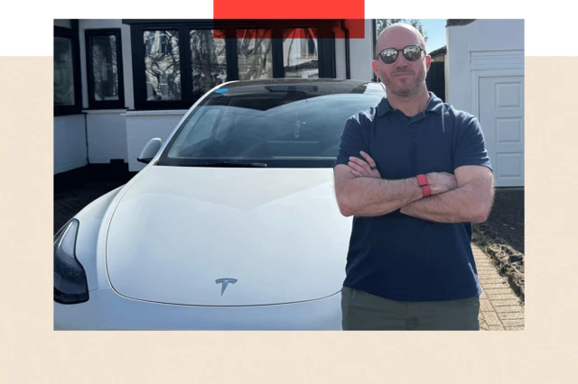 Ben Kilbey stands in front of his Tesla Model Y