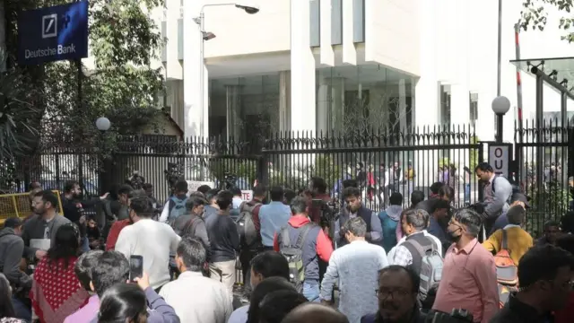 Media gather outside the British Broadcasting Corporation (BBC) offices in New Delhi, India 14 February 2023. The BBC's Delhi and Mumbai offices were raided by income tax officials as part of a tax evasion investigation