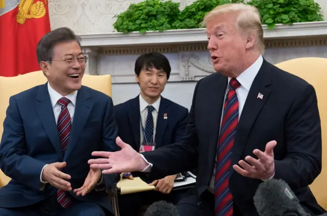 In this file photo taken on May 22, 2018, US President Donald Trump and South Korean President Moon Jae-in hold a meeting in the Oval Office of the White House in Washington, DC. Trump sees "brilliant potential" in North Korea, he tweeted on May 27, 2018, continuing an upbeat tone about a planned summit with the North"s leader Kim Jong Un. "I truly believe North Korea has brilliant potential and will be a great economic and financial Nation one day. Kim Jong Un agrees with me on this. It will happen!," said Trump, who had cancelled his June 12 meeting with Kim in Singapore, before reversing course within 24 hours. / AFP PHOTO / SAUL LOEBSAUL LOEB/AFP/Getty Images