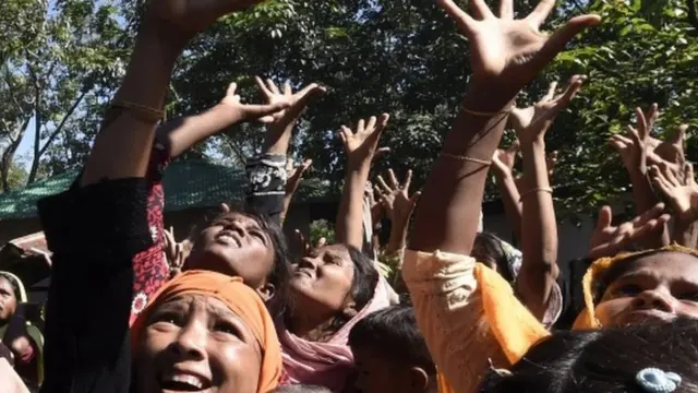 Rohingya Muslim refugees scuffle for relief supplies at Kutupalong refugee camp in Bangladesh"s Cox"s Bazar district.