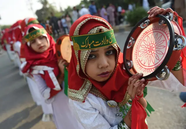 A Pakistani Muslim girl takes part in a rally during Eid Milad-un-Nabi