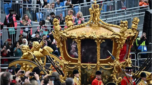 Queen hologram inside Gold State Coach